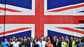 Conservative leadership candidate Boris Johnson poses for a photograph with workers at the Wight Shipyard Company at Venture Quay during a visit to the Isle of Wight, Britain 