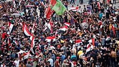 Demonstrators take part in a protest over corruption, lack of jobs, and poor services, in Baghdad