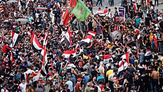 Demonstrators take part in a protest over corruption, lack of jobs, and poor services, in Baghdad