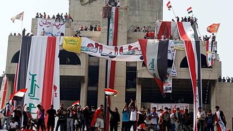 Defying curfew and crackdown, thousands carry coffin of dead protester