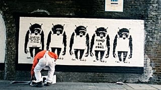 A picture, supposedly of elusive British artist Banksy at work 