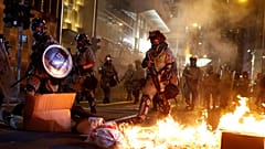 Xinhua offices burned as Hong Kong protests enter 22nd week