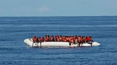 A rubber dinghy carrying migrants rescued by German NGO Sea-Eye ship Alan Kurdi is pictured at sea in the Mediterranean, October 26, 2019. Picture taken October 26, 2019. 