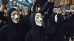 Defiant Hong Kong protesters mark one-month ban on masks