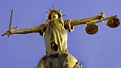 A statue over the Old Bailey court in central London.