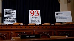 Signs are placed behind seats of committee members at a House Intelligence Committee hearing as part of the impeachment inquiry into U.S. President Donald Trump 