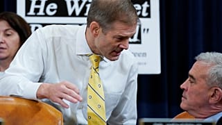 Rep. Jim Jordan talks with colleague Rep. Brad Wenstrup during a break as Marie Yovanovitch, former U.S. ambassador to Ukraine, testifies before House Intelligence Committee
