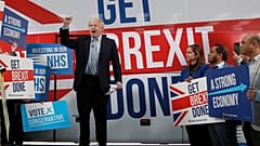 Britain's Prime Minister Boris Johnson addresses his supporters in front of the general election campaign trail bus in Manchester, Britain November 15, 2019.