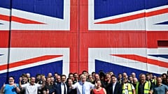 Boris Johnson with workers at the Wight Shipyard Company at Venture Quay during a visit to the Isle of Wight, Britain June 27, 2019.