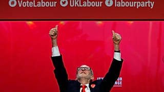 Jeremy Corbyn waves to cheering students at the Labour manifesto launch