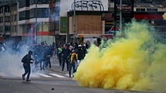 Demonstrators clash with riot police during a protest in Bogota, Colombia, November 21, 2019.