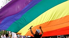 Participants march under a giant rainbow flag during the LGBT Pride parade in Taipei, Taiwan