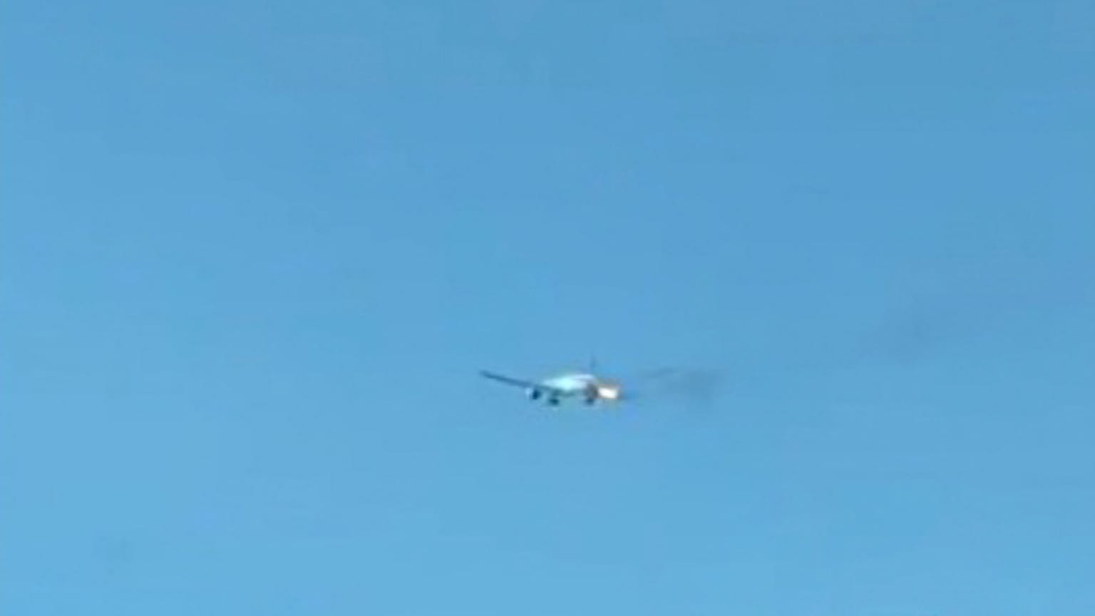 Plane makes emergency landing after flames burst from engine