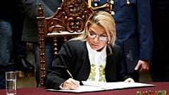 Bolivia's interim President Jeanine Anez enacts the law for general election at the national congress in La Paz, Bolivia, November 24, 2019.