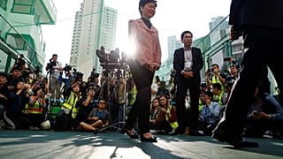 Hong Kong Chief Executive Carrie Lam leaves after speaking to the media, after casting her vote at a polling station during district council local elections in Hong Kong