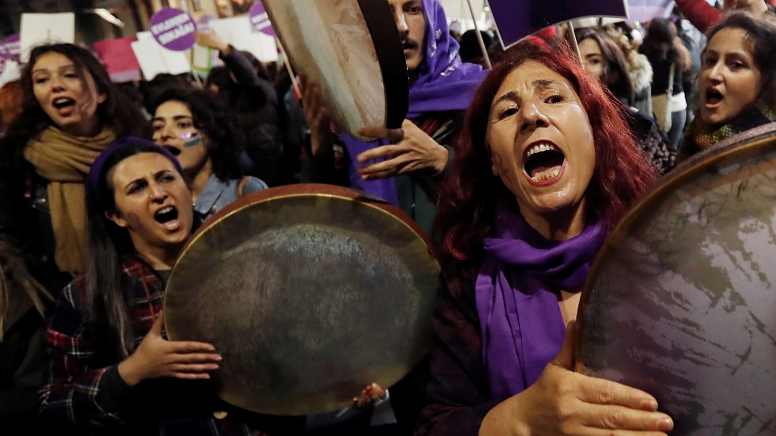 Demonstrators shout slogans during a protest against femicide and violence against women, in Istanbul