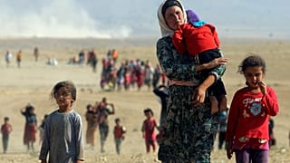 شماری از اقلیت ایزدی عراق در سال ۲۰۱۴ به سوی مرز سوریه می‌روند 