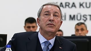 Turkish Defence Minister Hulusi Akar attends a briefing at the Land Forces' Forward Joint Operation Command Center in Sanlıurfa