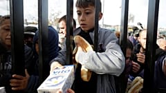Residents crowd aid centre for food after deadly Albania quake