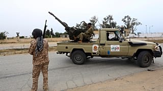 FILE PHOTO: Tripoli government forces look on during clashes with forces led by Field Marshal Khalifa Hifter south of the capital Tripoli, Libya on Tuesday, May 21, 2019.