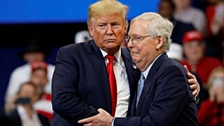 Senator Mitch McConnell (R-KY) hugs U.S. President Donald Trump at a Keep America Great Rally at the Rupp Arena in Lexington, Kentucky, U.S., November 4, 2019