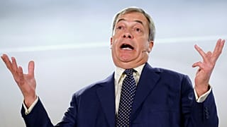 FILE PHOTO: Brexit Party leader Nigel Farage gestures as he speaks during a visit to Buckley, Britain December 2, 2019. 