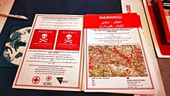 Minen in Bosnien: Flyer warnen Geflüchtete in 5 Sprachen