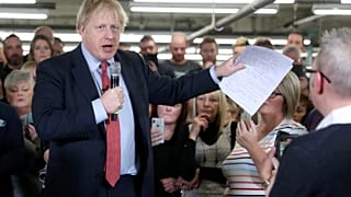 Britain's Prime Minister Boris Johnson delivers a speech during a meeting with workers as he visits John Smedley Mill in Matlock, Derbyshire, Britain December 5, 2019.