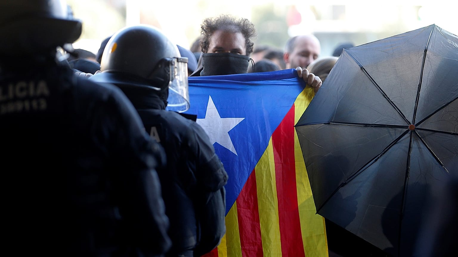 Catalan separatist protester displays an Estelada (Catalan separatist flag) during a demonstration outside the Sants train station in Barcelona, Spain November 16, 2019.