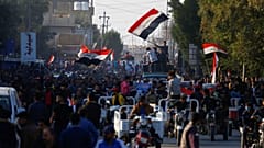 مقتل 12 متظاهراً على الأقل على يد مسلحين مجهولين وسط بغداد