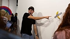 Crowds pose with the pricey banana artwork