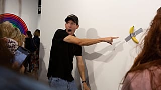 Crowds pose with the pricey banana artwork