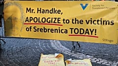 A banner protesting against 2019 Nobel literature prize laureate Peter Handke is seen at the Stockholm Concert Hall, in Stockholm, Sweden, December 10, 2019.