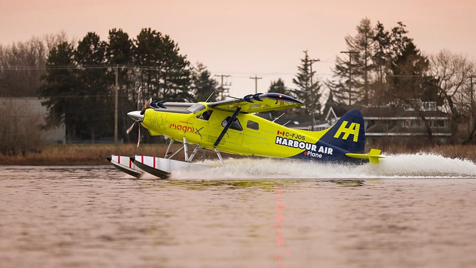 A Habour Air seaplane powered by an magniX all-electric propulsion system lands after a test flight on December 10, 2019.