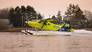 A Habour Air seaplane powered by an magniX all-electric propulsion system lands after a test flight on December 10, 2019.