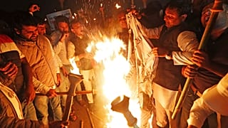 Members of the youth wing of India's main opposition Congress party burn a copy of Citizenship Amendment Bill