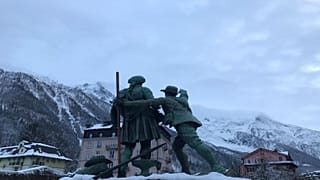 Chamonix, 12 December 2019 - Statue of Jaques Balmat showing Horace Benedict de Sassure the route up to the summit of Mont Blanc.