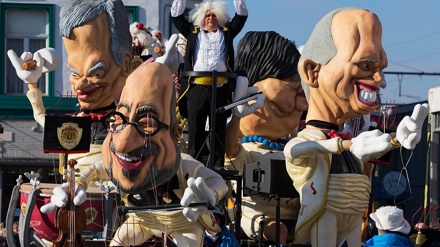 Giant figures depicting Belgian Prime Minister Charles Michel (C) and other politicians are seen during the 87th carnival parade of Aalst February 15, 2015.