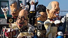 Giant figures depicting Belgian Prime Minister Charles Michel (C) and other politicians are seen during the 87th carnival parade of Aalst February 15, 2015.
