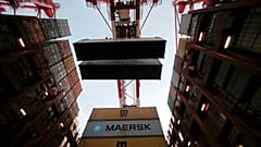 FILE PHOTO: Containers are seen unloadedat the Yangshan Deep Water Port, part of the Shanghai Free Trade Zone, in Shanghai, China, September 24, 2016. 