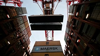 FILE PHOTO: Containers are seen unloadedat the Yangshan Deep Water Port, part of the Shanghai Free Trade Zone, in Shanghai, China, September 24, 2016. 