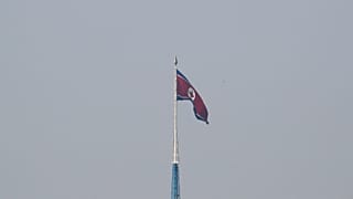 A North Korean flag flutters on top of a tower at North Korea's propaganda village of Gijungdong, as seen from Paju, South Korea, September 30, 2019.