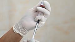 A nurse fills a syringe with a vaccine before administering an injection at a children's clinic in Kiev, Ukraine August 14, 2019. Picture taken August 14, 2019.