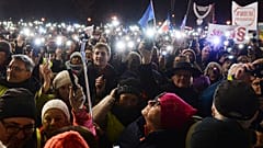 People take part in a street demonstration to show solidarity with judges facing increased political pressure from the country's right-wing government in Warsaw, Poland, Sunda