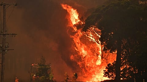 A fire truck is seen during a bushfire near Bilpin, 90km north west of Sydney, Thursday, December 19, 2019. (AAP Image/Mick Tsikas) NO ARCHIVING