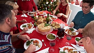 A family eating vegan Christmas dinner