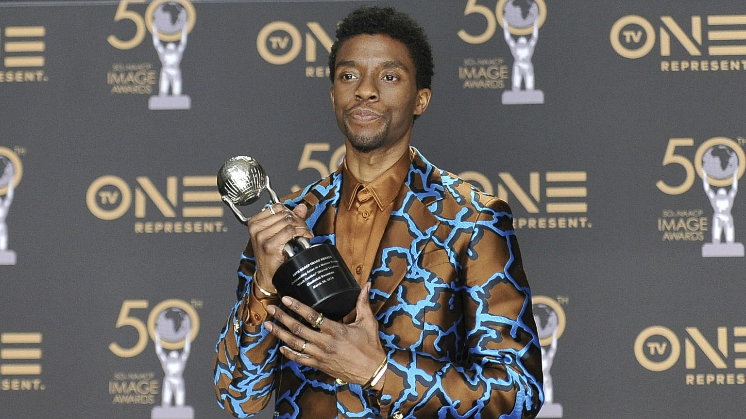 Chadwick Boseman, a cast member in Black Panther, poses at the premiere of the film in Los Angeles.