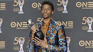 Chadwick Boseman, a cast member in Black Panther, poses at the premiere of the film in Los Angeles.
