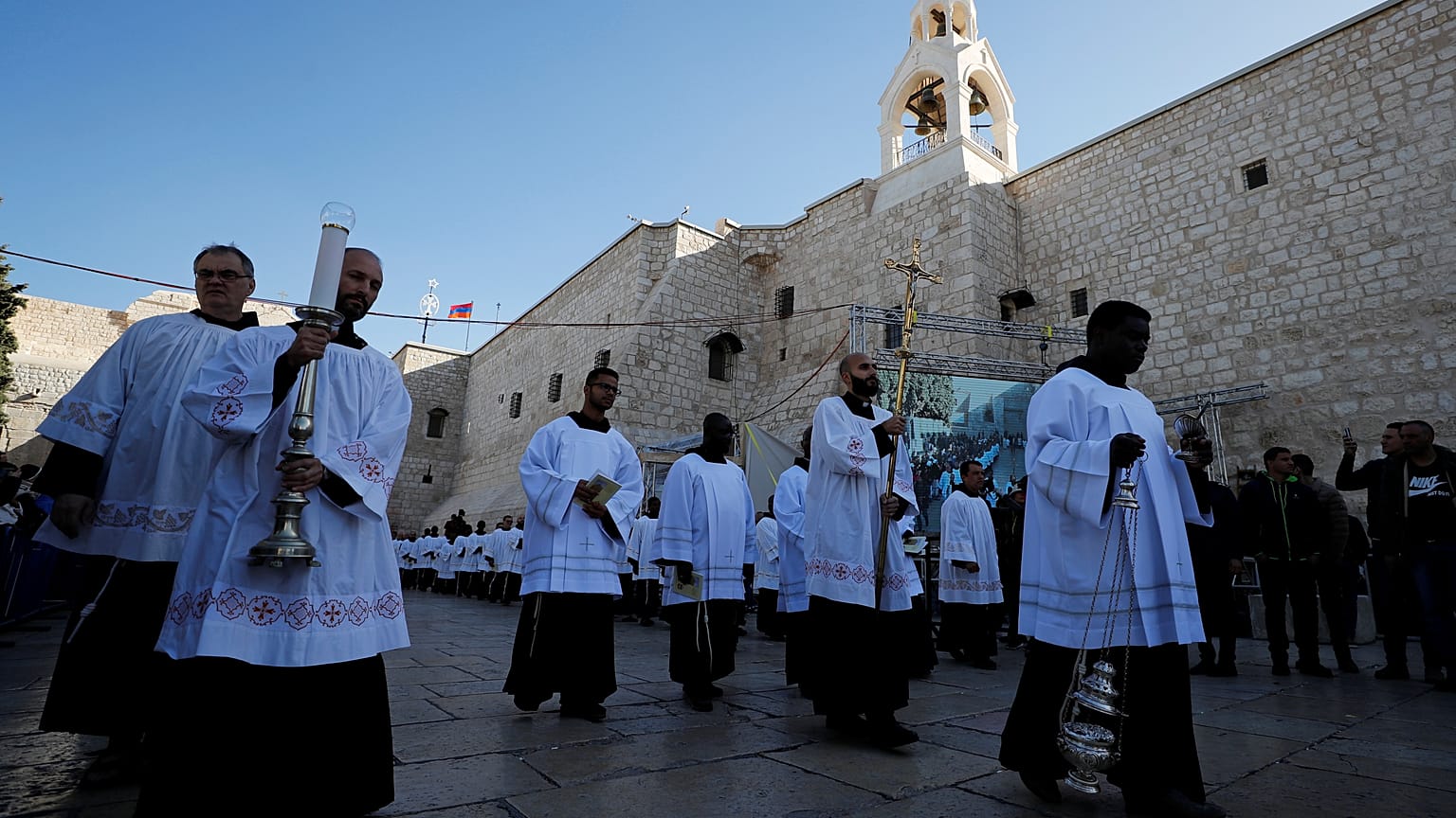 Clergymen attend Christmas celebrations at Manger Square outside the Church of the Nativity in Bethlehem, in the Israeli-occupied West Bank December 24, 2019. 