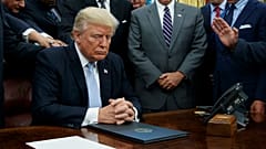 Faith leaders pray with President Donald Trump in the Oval Office of the White House